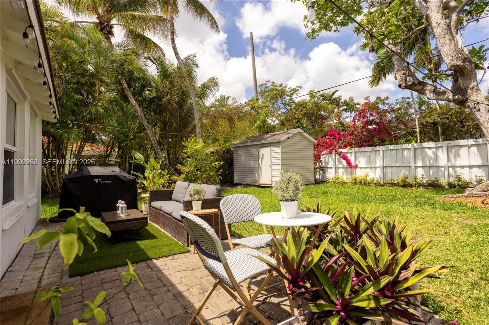 5755 Devonshire Boulevard, Unit 5755 Miami, FL 33155 - Photo 30 of 30 a view of an house with backyard and patio