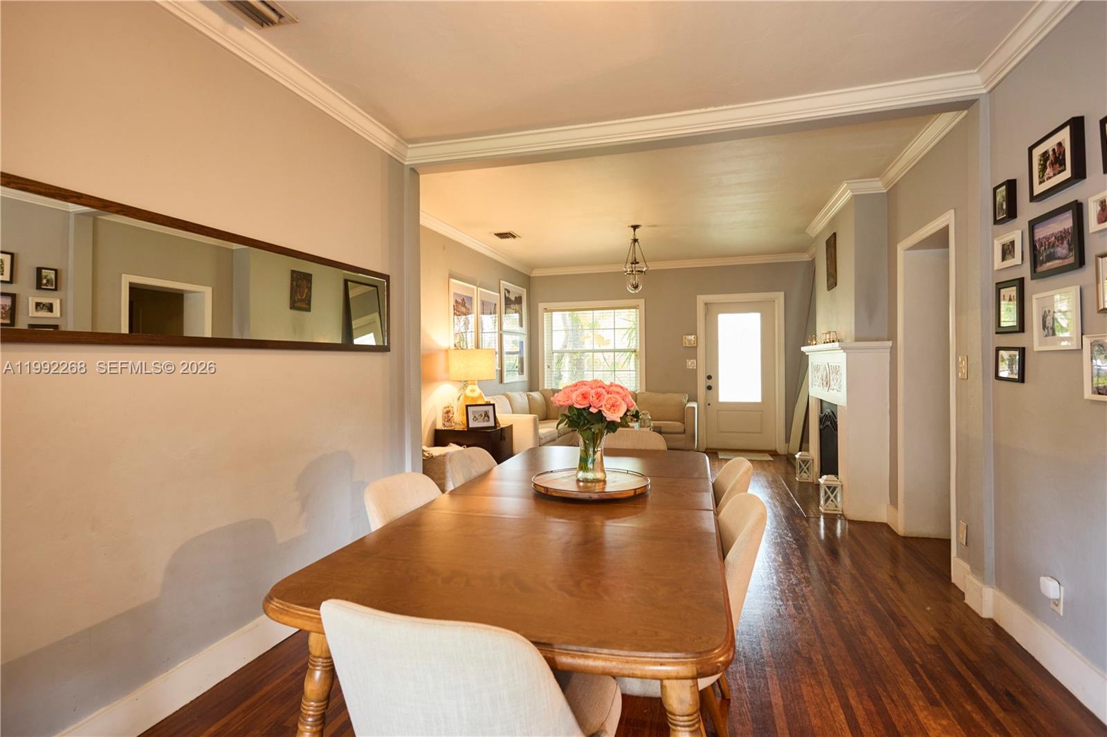 5755 Devonshire Boulevard, Unit 5755 Miami, FL 33155 - Photo 8 of 30 a view of a dining room with furniture and wooden floor