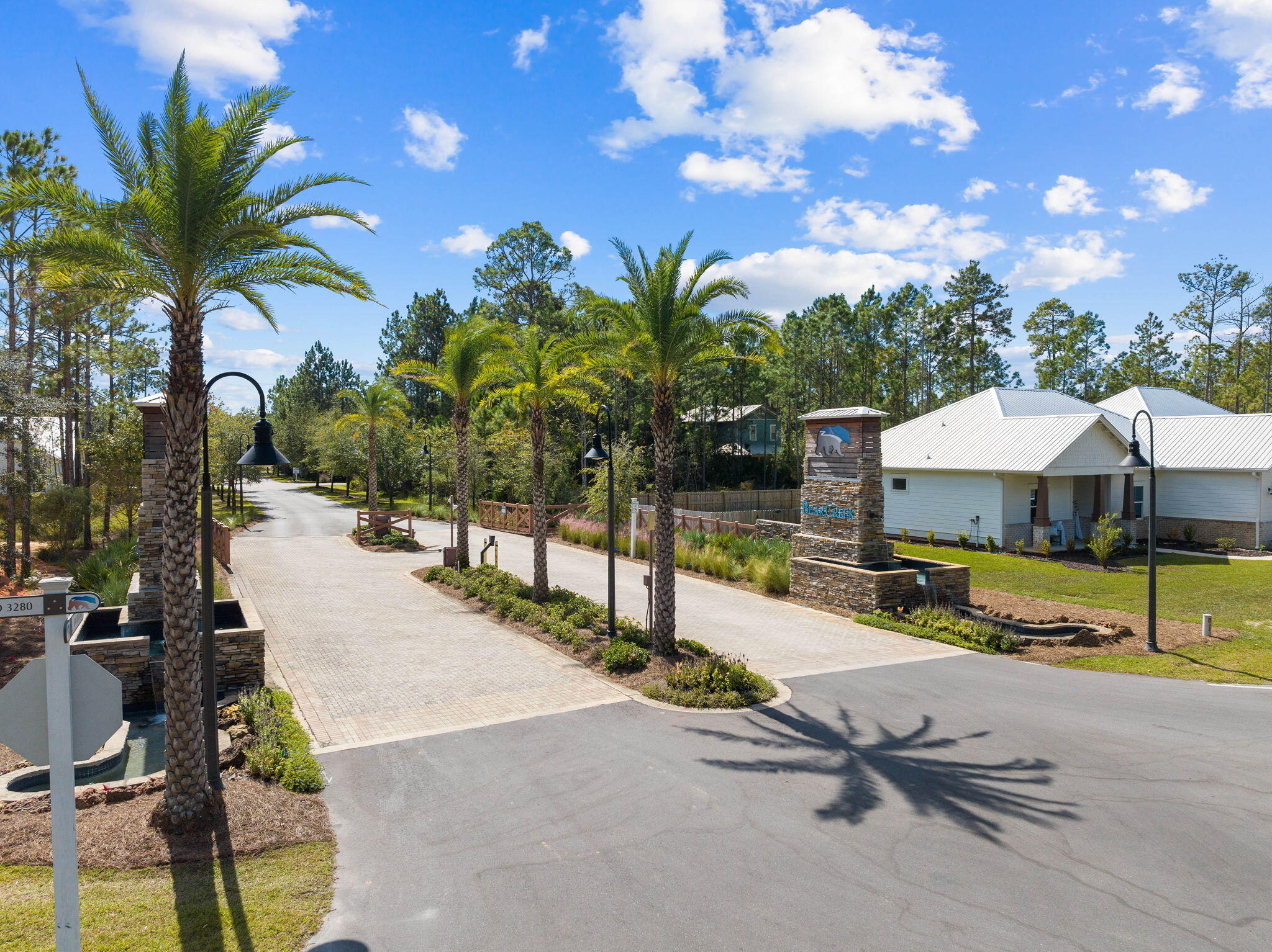 a view of a swimming pool with a lounge chair and tables