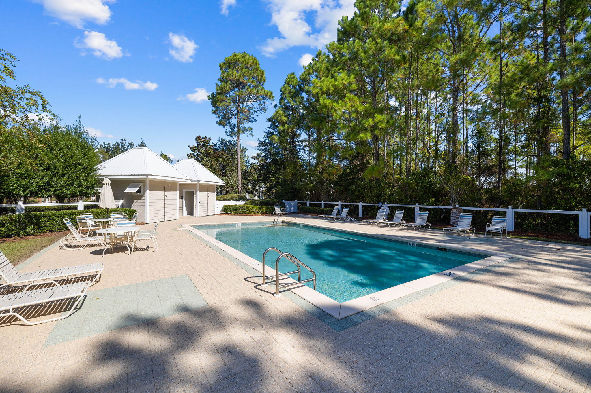 Lot 11 Sun Bear Circle Freeport, FL 32439 - Photo 26 of 28 a view of a patio with a table and chairs under an umbrella