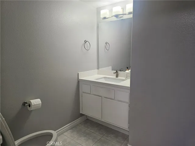 a bathroom with a sink a vanity and mirror
