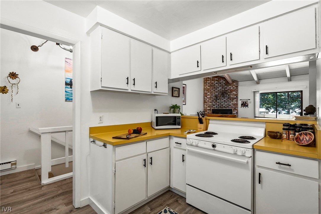 321 Ski Way, Unit 137 Incline Village, NV 89451 - Photo 14 of 21 a kitchen with white cabinets and white appliances