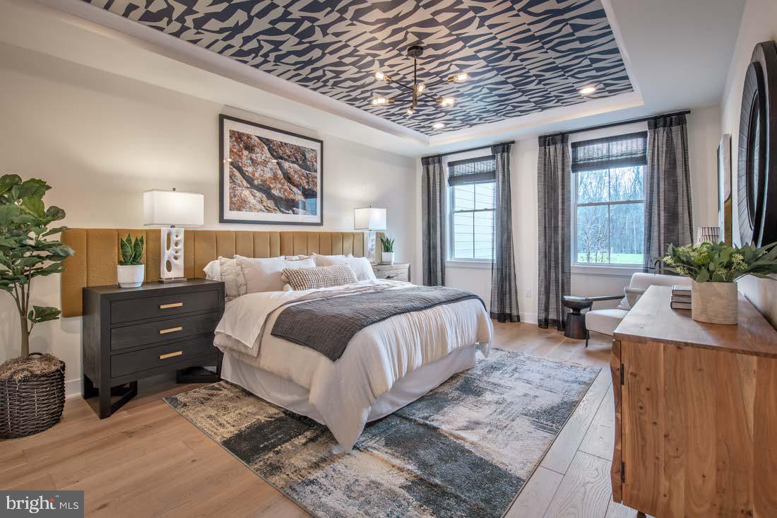 311 Kyle Lane, Unit HOMESITE 101 Langhorne, PA 19047 - Photo 2 of 8 a spacious bedroom with a bed a dresser and next to a window