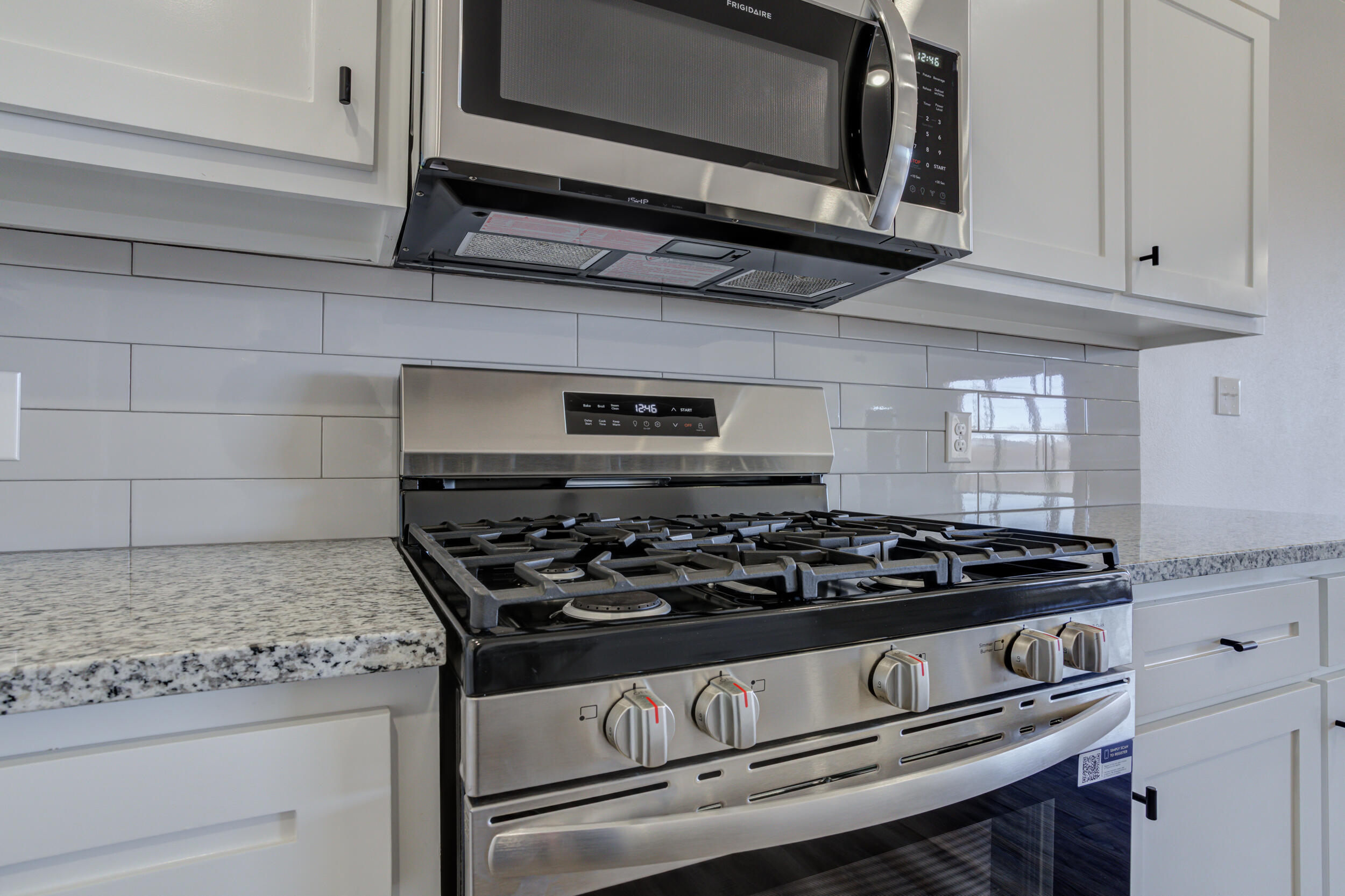 1005 Quincy Avenue Lubbock, TX 79416 - Photo 18 of 46 a stove top oven sitting inside of a kitchen