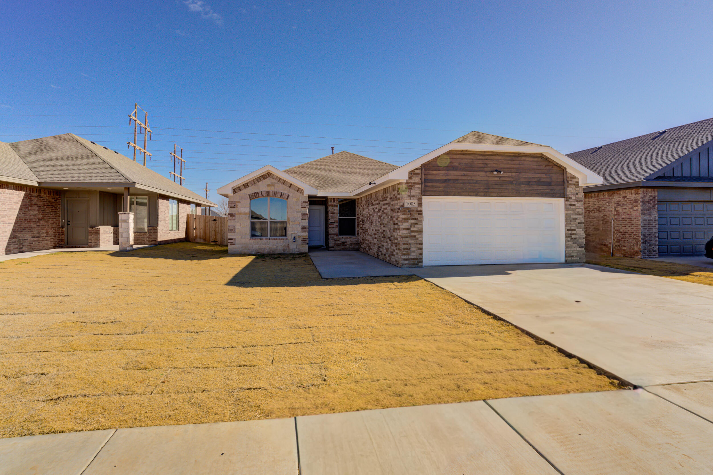 1005 Quincy Avenue Lubbock, TX 79416 - Photo 2 of 46 a front view of a house with a yard
