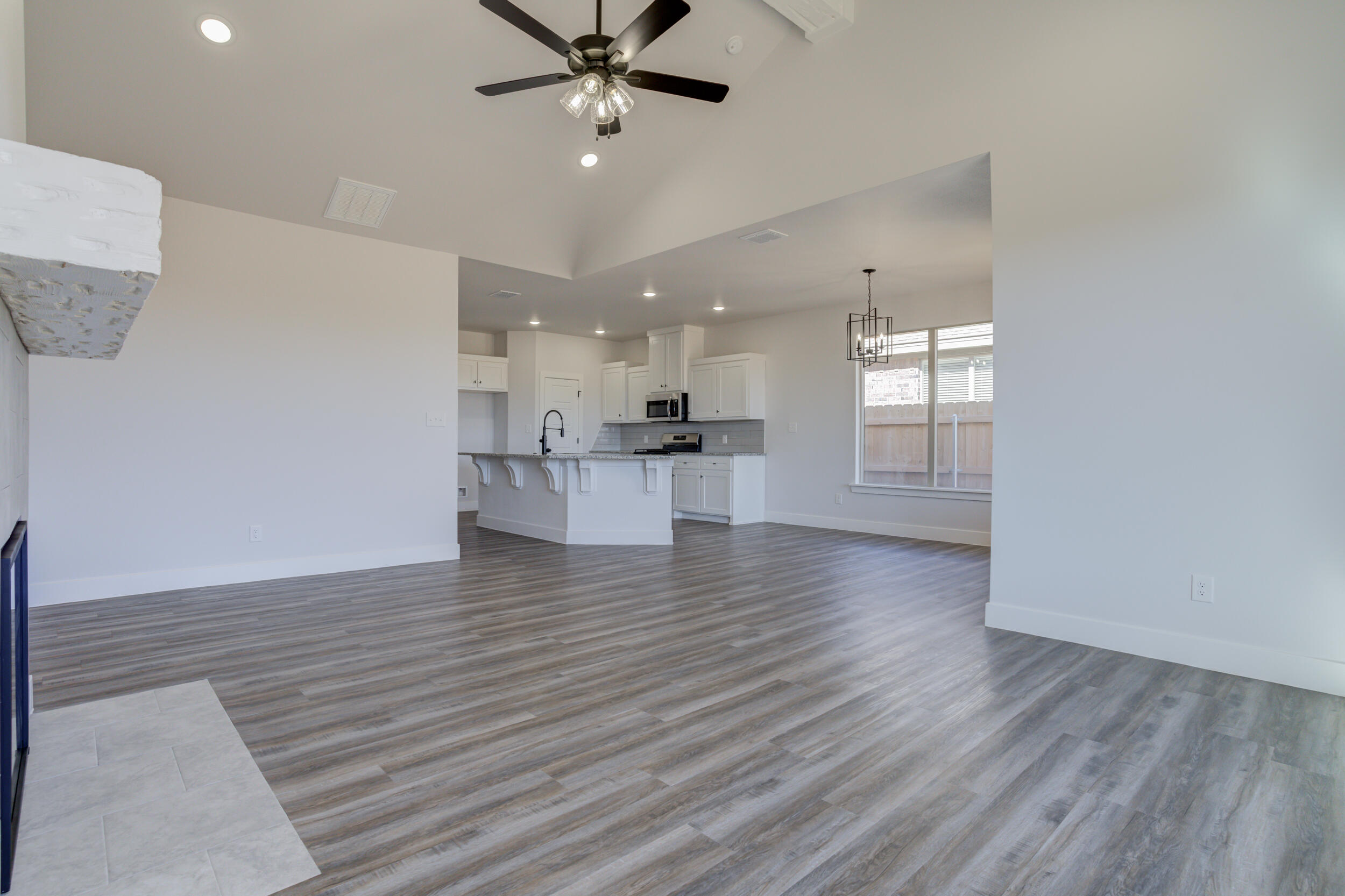 1005 Quincy Avenue Lubbock, TX 79416 - Photo 29 of 46 a view of a kitchen with a dishwasher cabinets and wooden floor