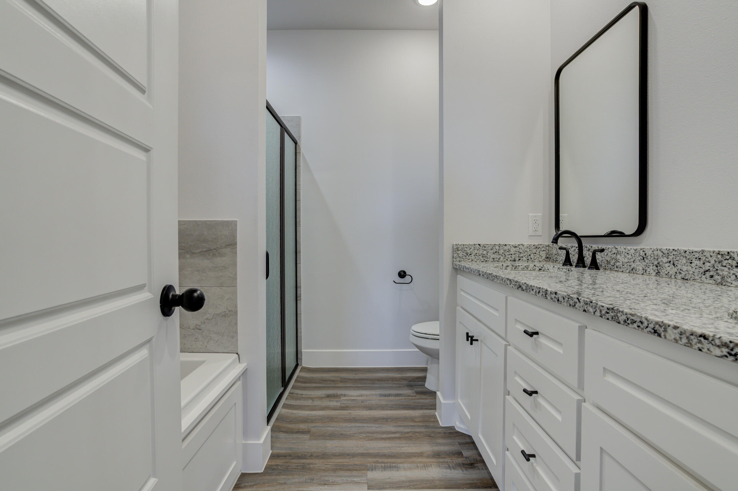 1005 Quincy Avenue Lubbock, TX 79416 - Photo 37 of 46 a bathroom with a double vanity sink and a mirror