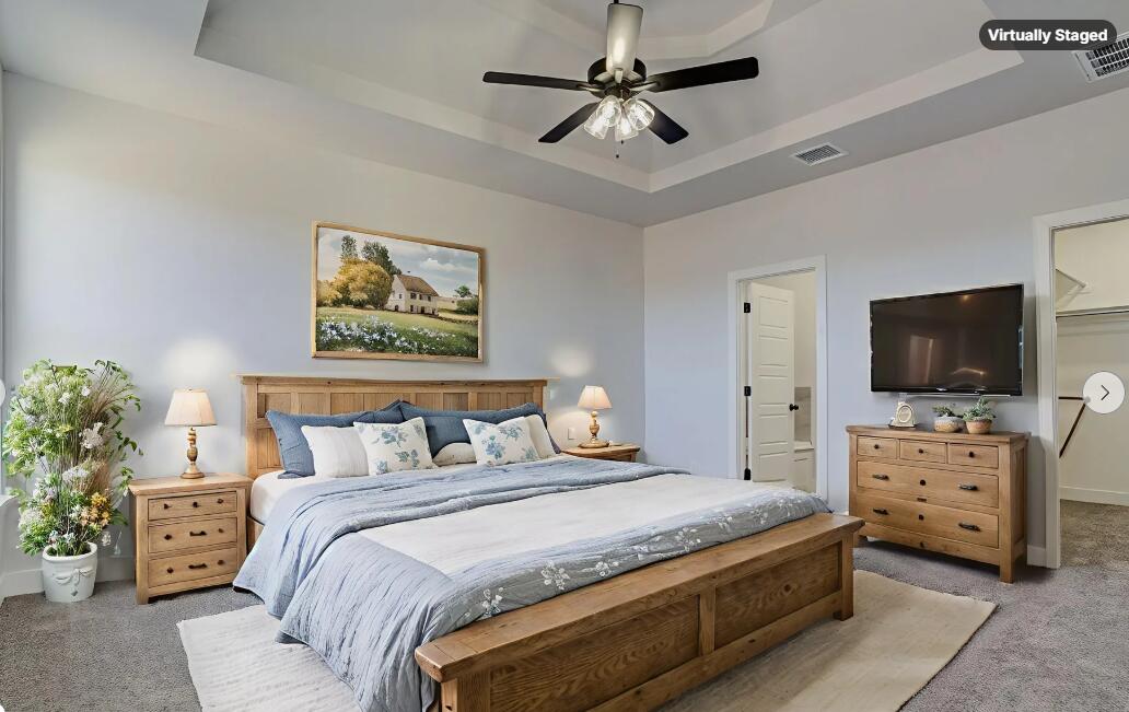 1005 Quincy Avenue Lubbock, TX 79416 - Photo 6 of 46 a bedroom with a bed and a flat screen tv