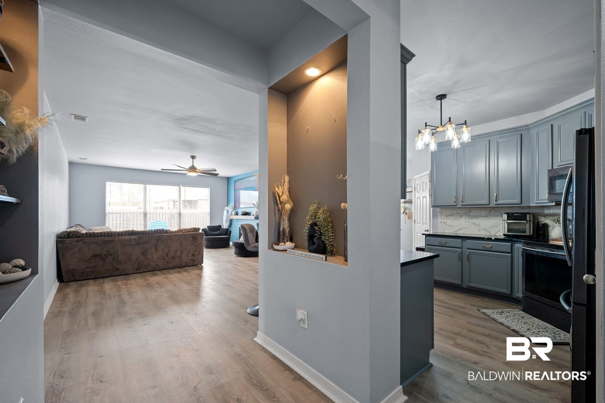1287 Pembroke Way Foley, AL 36535 - Photo 39 of 39 Kitchen with light wood-type flooring, gray cabinets, stainless steel appliances, a chandelier, and open floor plan