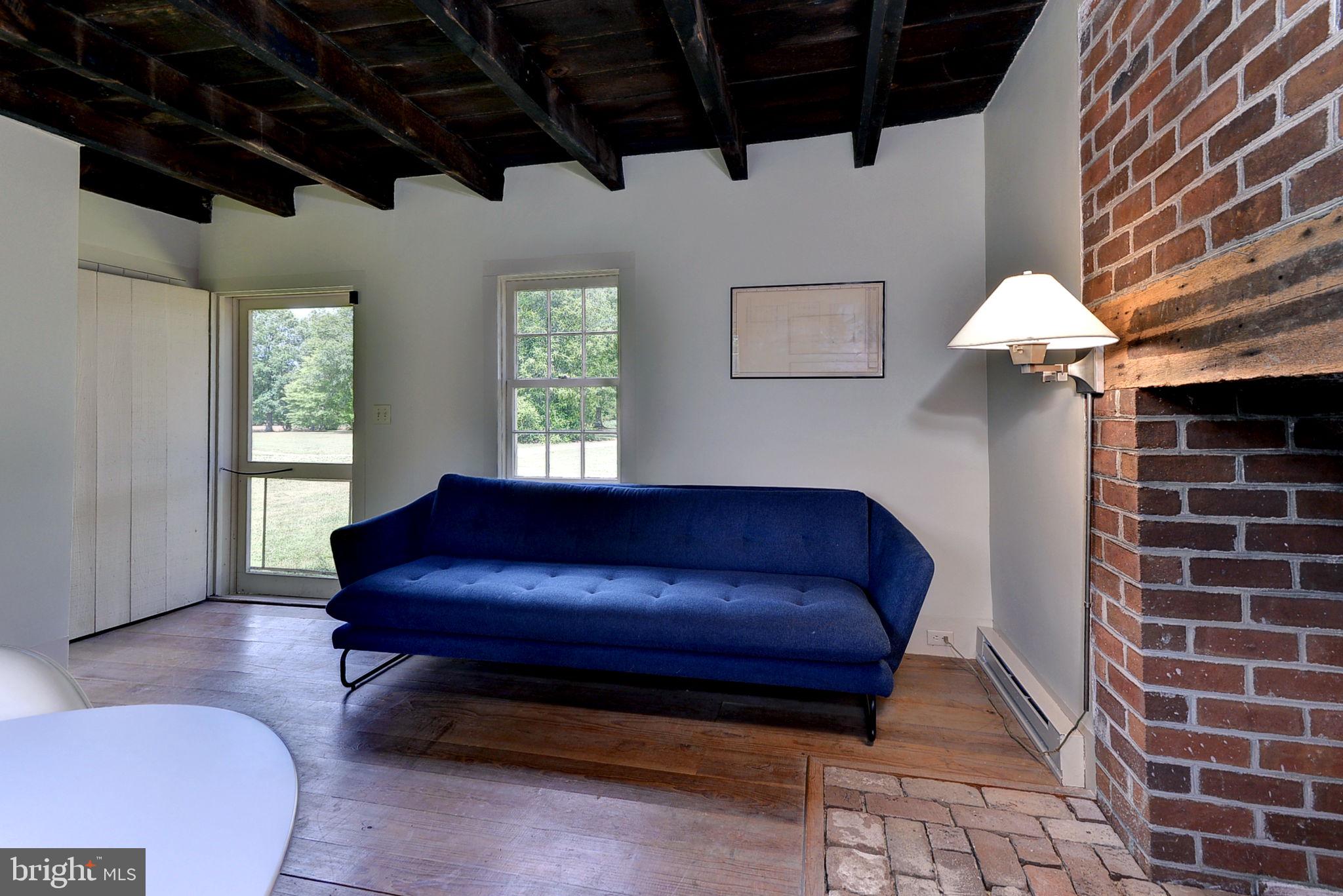 2459 Dunbrooke Road Tappahannock, VA 22560 - Photo 54 of 85 a living room with furniture and a potted plant