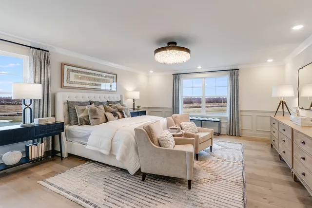 a spacious bedroom with a bed and a couch