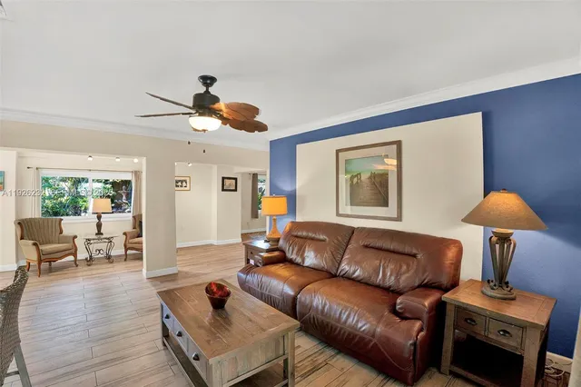 a living room with furniture a couch and a window