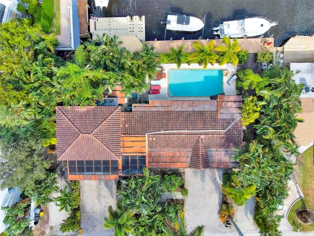 an aerial view of a house with a yard and garden view