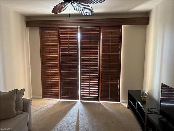 a view of livingroom with furniture and a window