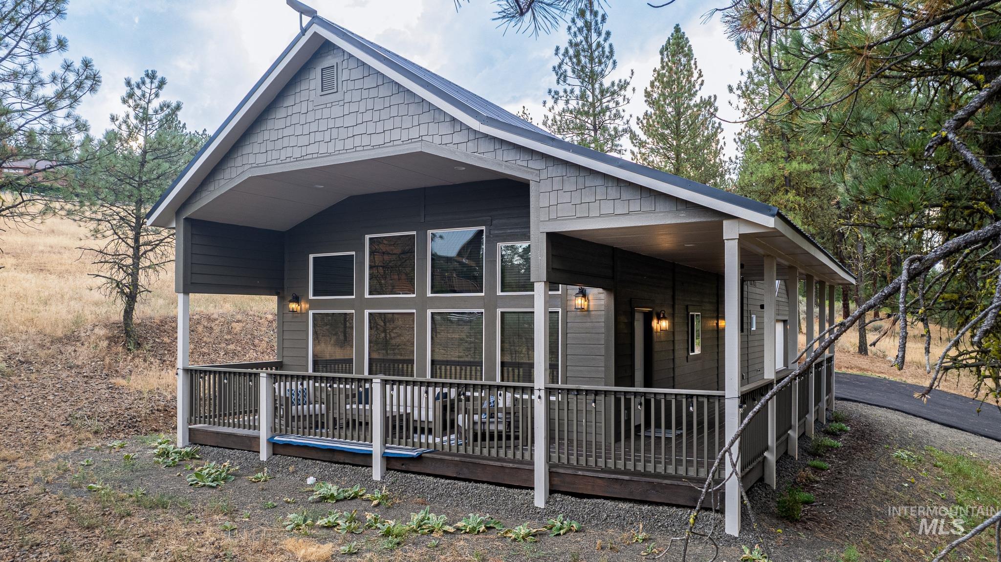 3879 Hot Springs Road New Meadows, ID 83654 - Photo 1 of 1 Rear view of property with a wooden deck