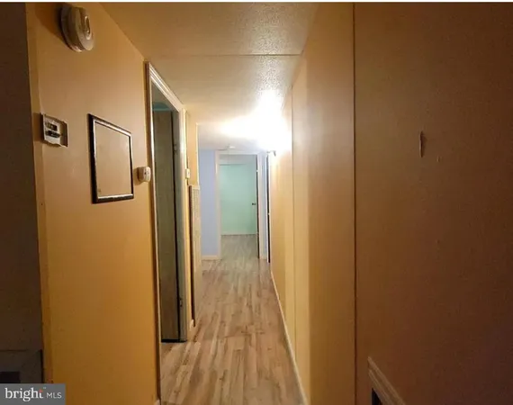 a view of a bathroom from a hallway