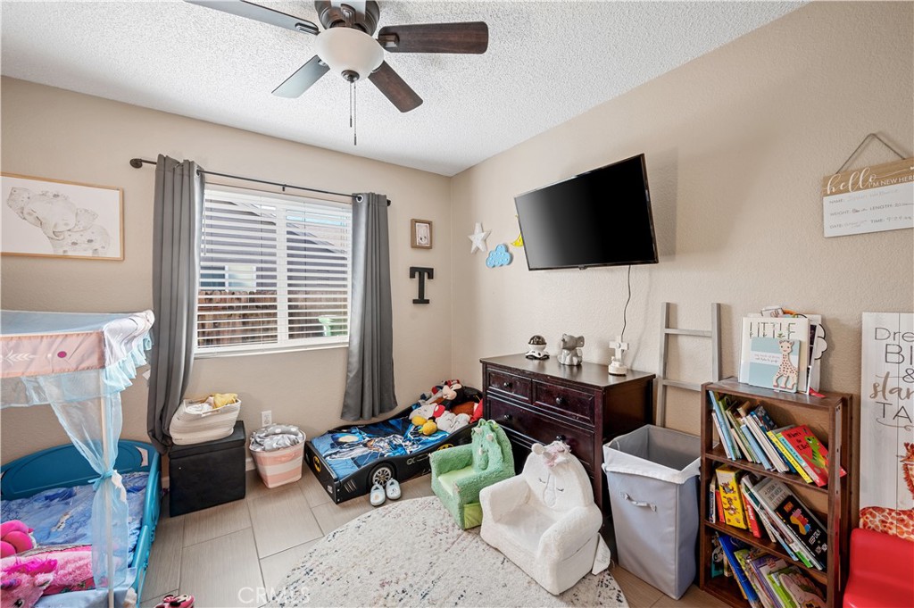 47800 Madison Street, Unit 174 Indio, CA 92201 - Photo 11 of 24 a living room with furniture and a flat screen tv
