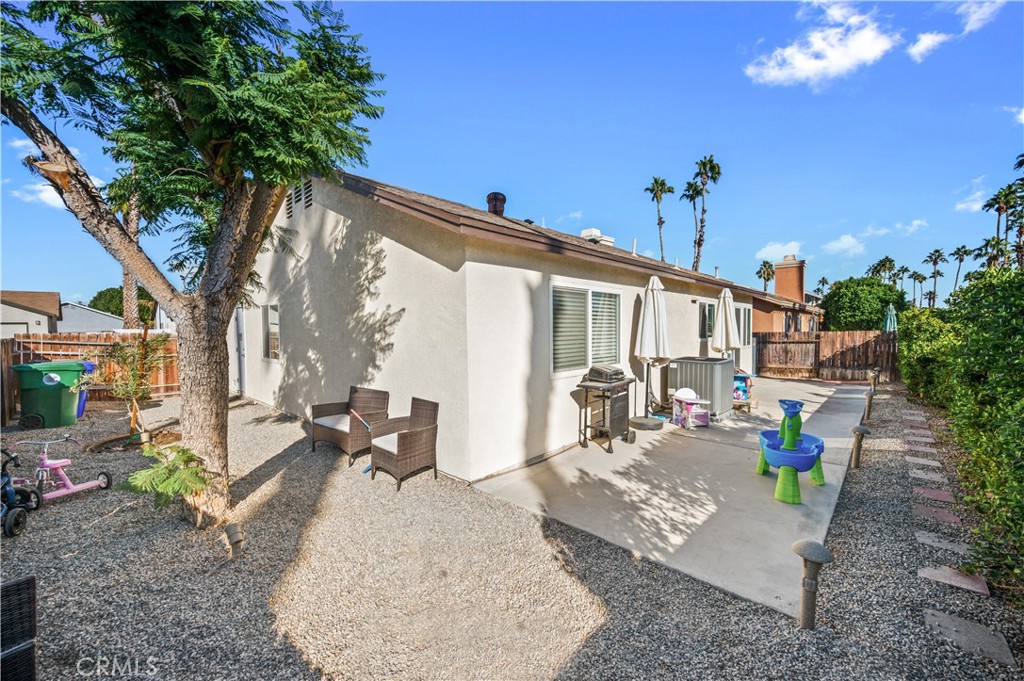 47800 Madison Street, Unit 174 Indio, CA 92201 - Photo 17 of 24 a view of a patio with couches table and chairs and potted plants