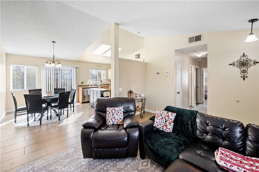 47800 Madison Street, Unit 174 Indio, CA 92201 - Photo 5 of 24 a living room with furniture and a dining table