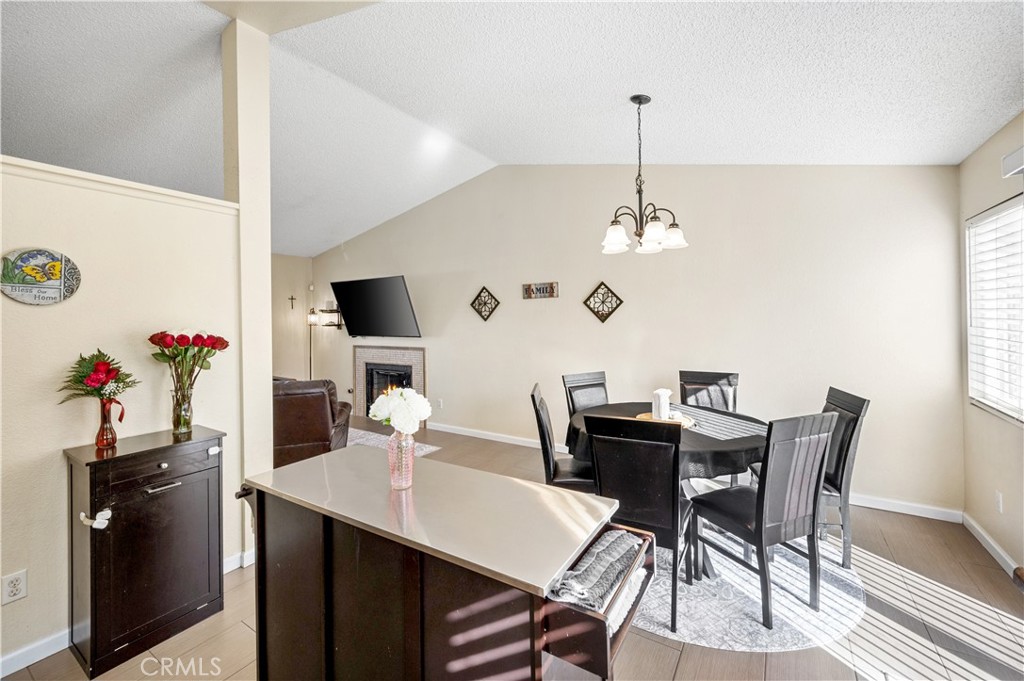47800 Madison Street, Unit 174 Indio, CA 92201 - Photo 8 of 24 a view of a dining room with furniture and wooden floor