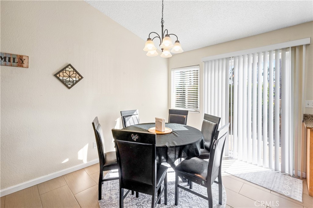 47800 Madison Street, Unit 174 Indio, CA 92201 - Photo 9 of 24 a view of a dining room with furniture and window