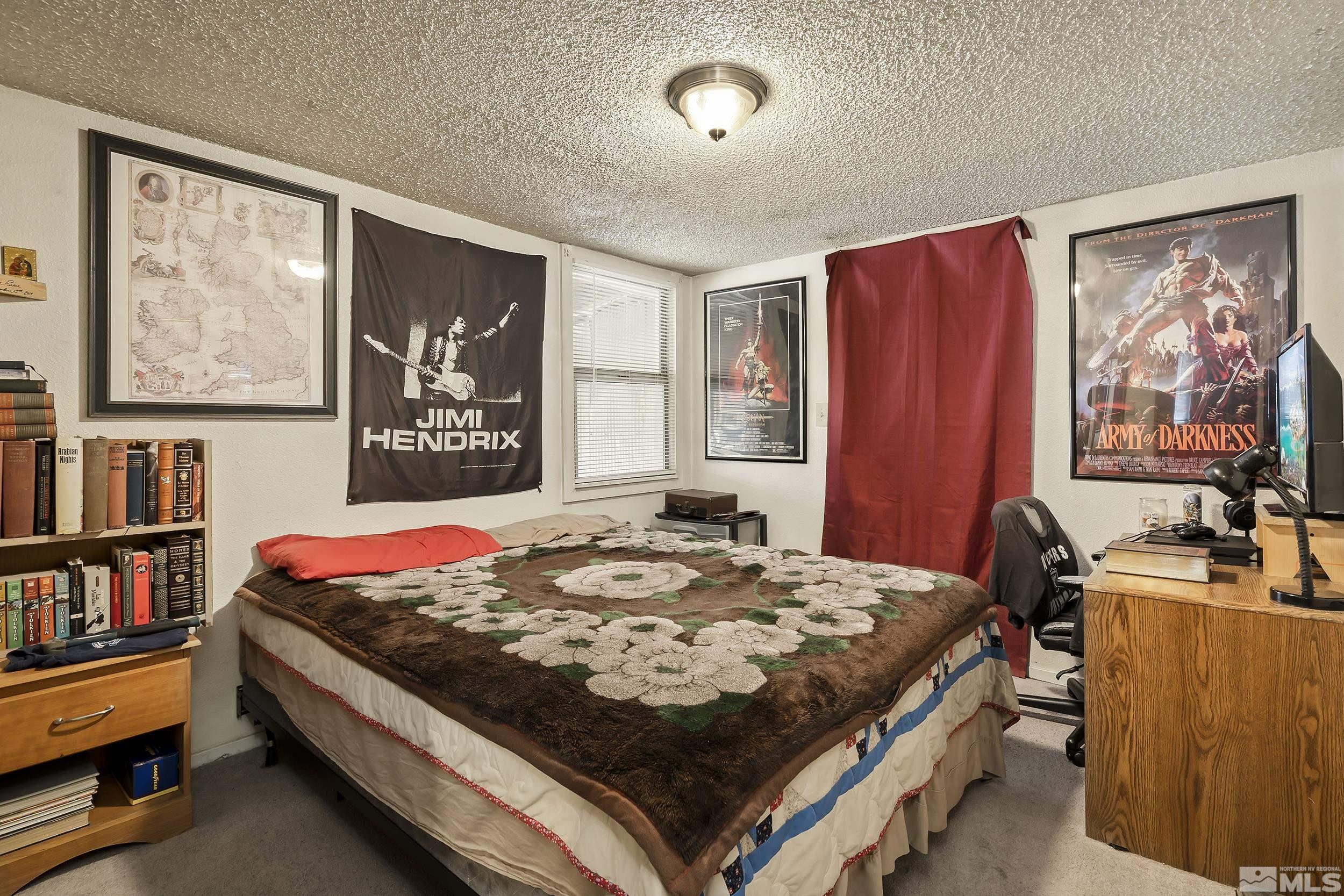 1078 Haskell Street Reno, NV 89509 - Photo 14 of 15 a bed sitting in a bedroom next to a window