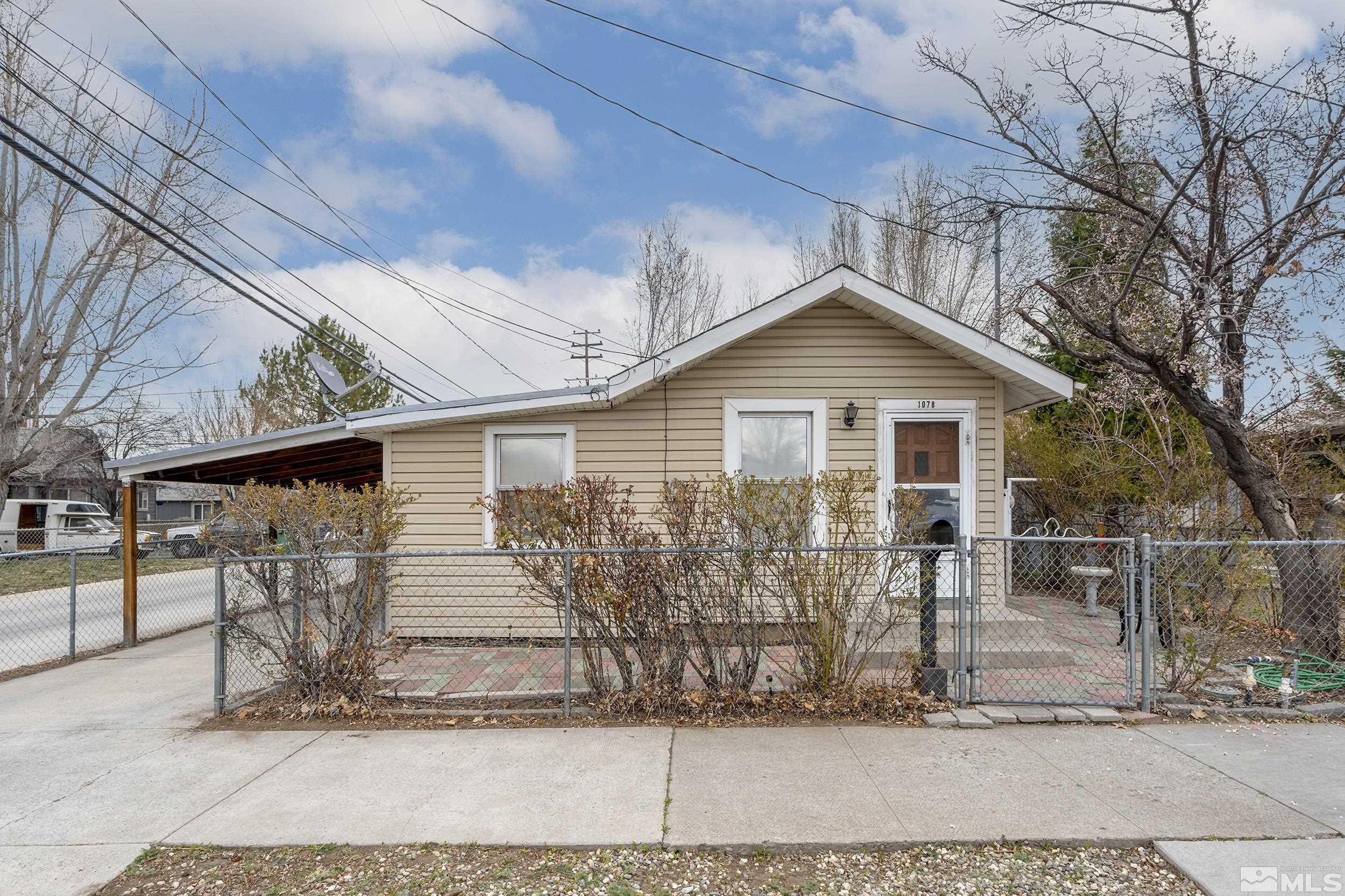 1078 Haskell Street Reno, NV 89509 - Photo 2 of 15 a front view of a house with garage