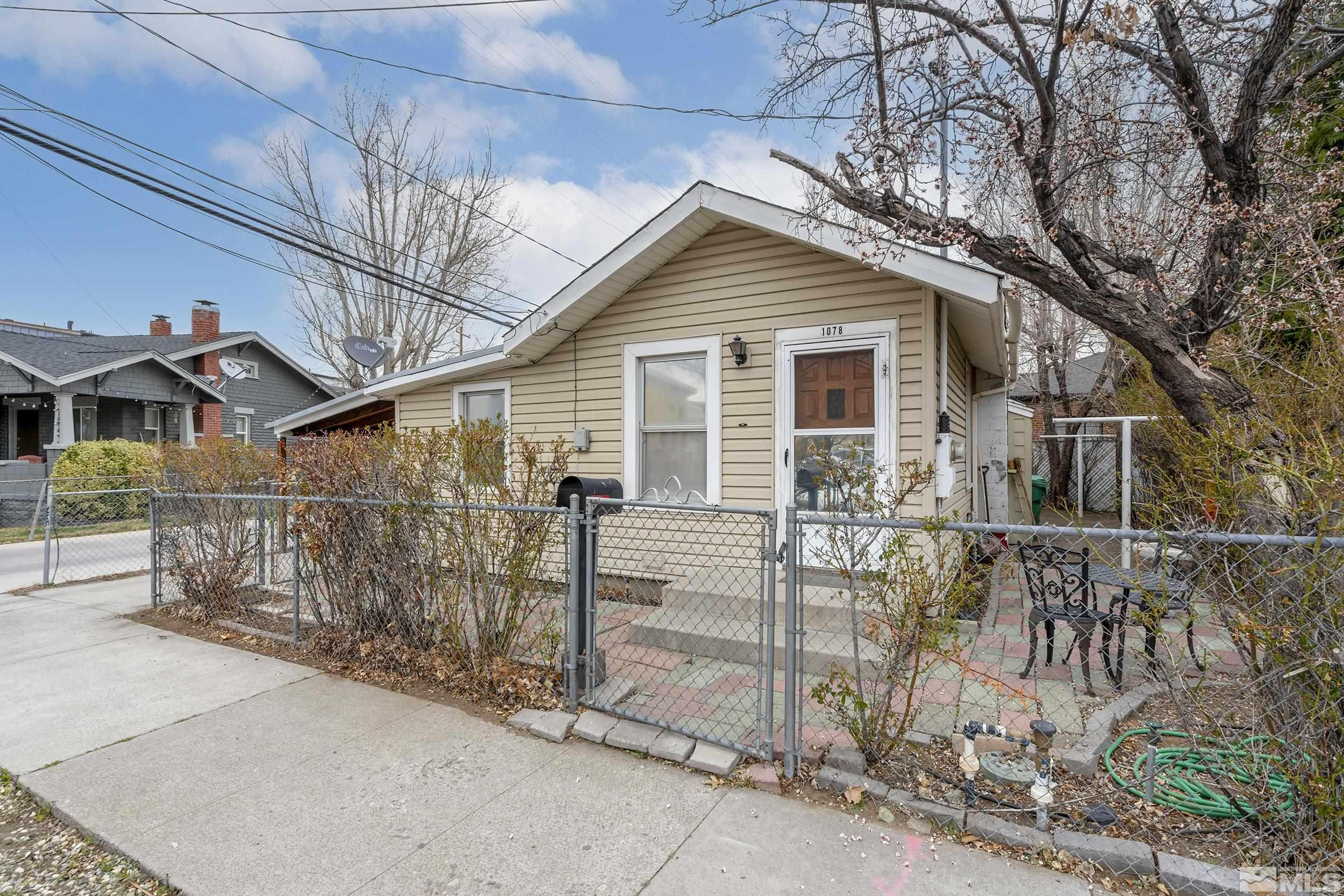 1078 Haskell Street Reno, NV 89509 - Photo 3 of 15 a view of a house with wooden fence