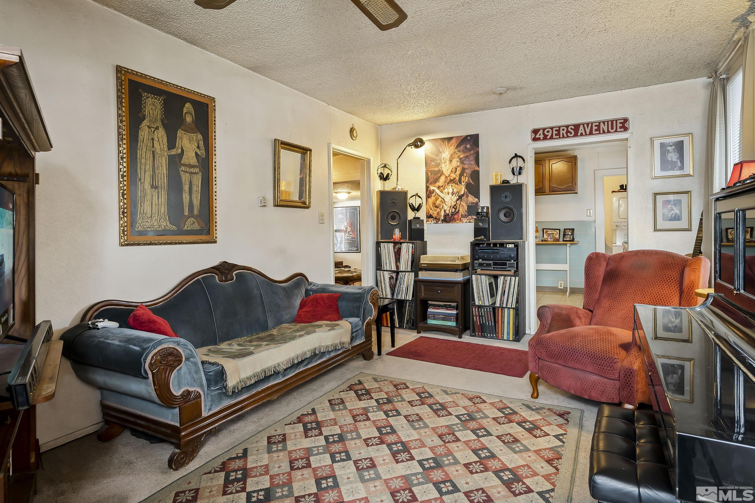 1078 Haskell Street Reno, NV 89509 - Photo 4 of 15 a living room with furniture and a couch