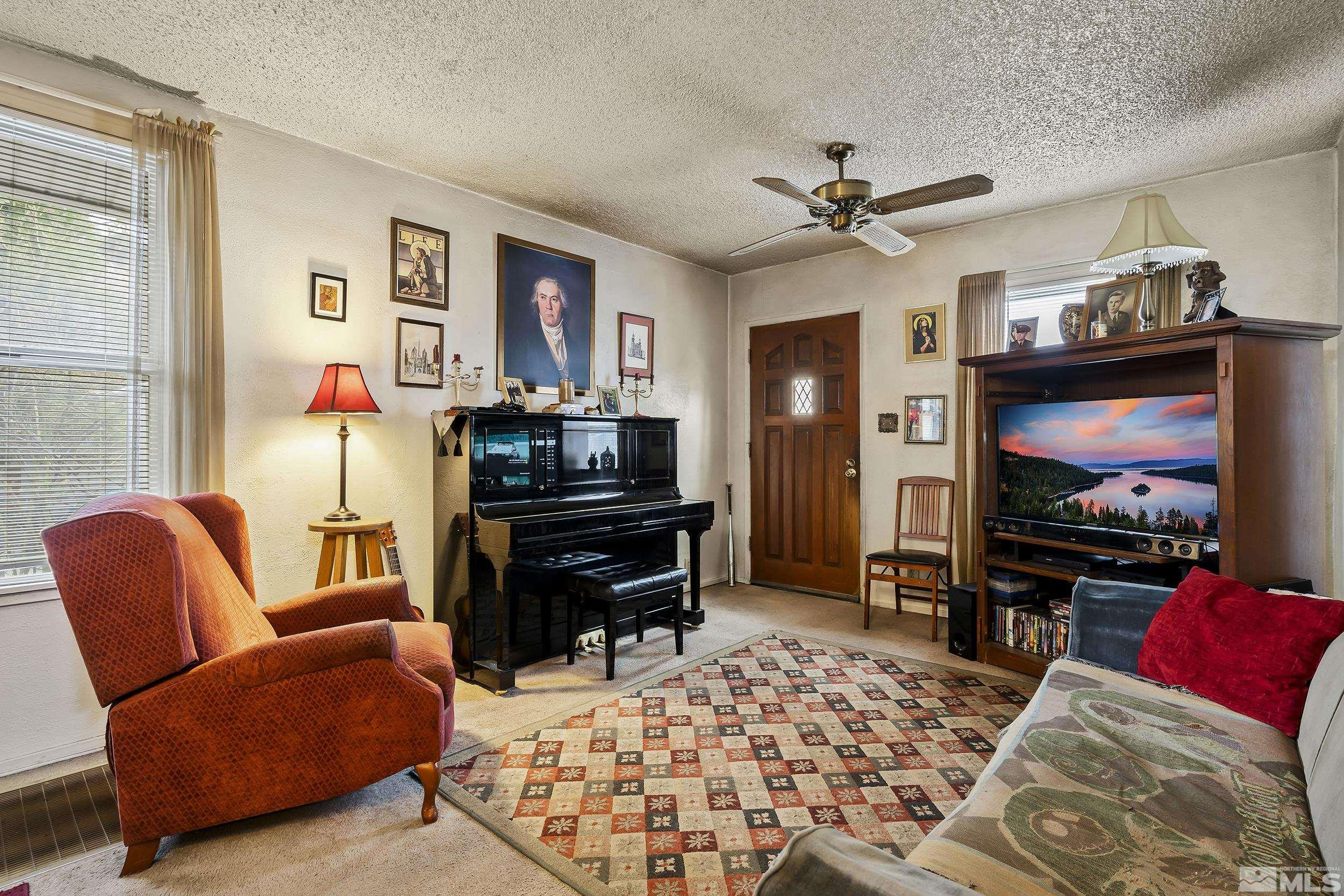 1078 Haskell Street Reno, NV 89509 - Photo 5 of 15 a living room with furniture and a flat screen tv