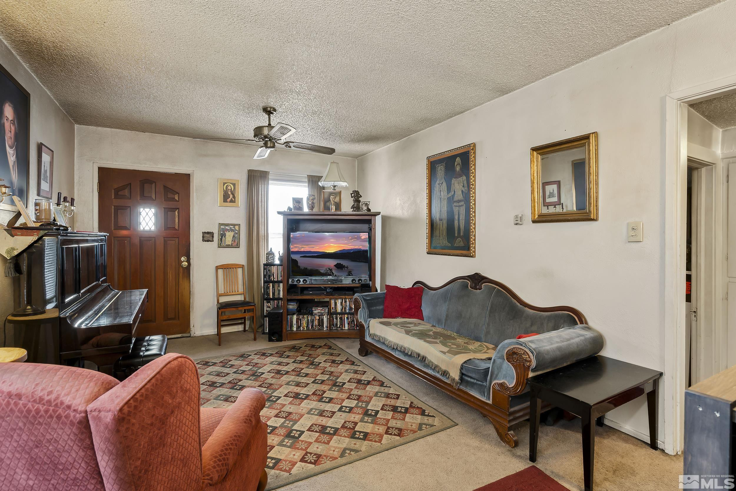 1078 Haskell Street Reno, NV 89509 - Photo 6 of 15 a living room with furniture and a flat screen tv