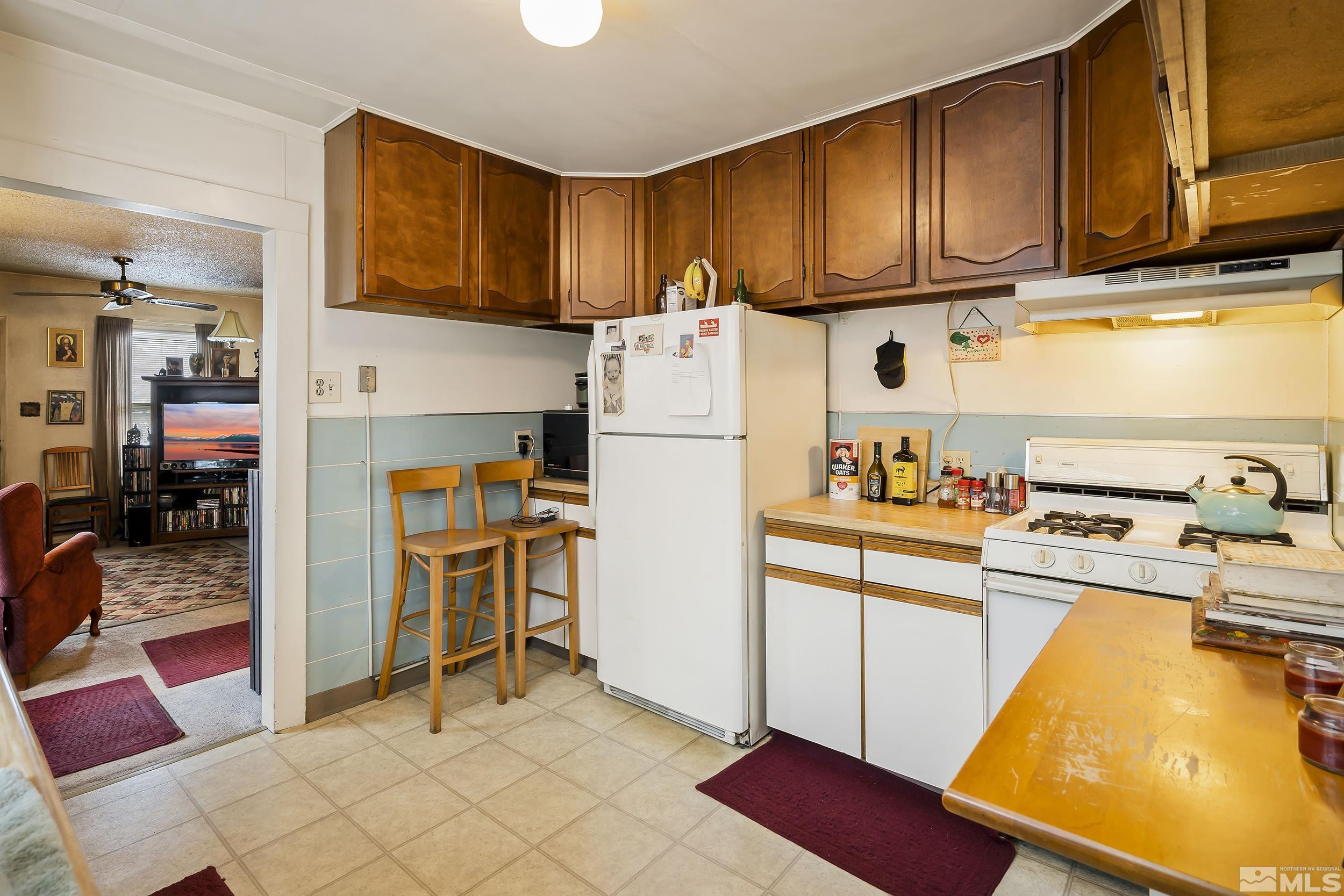 1078 Haskell Street Reno, NV 89509 - Photo 10 of 15 a kitchen with a refrigerator sink and cabinets