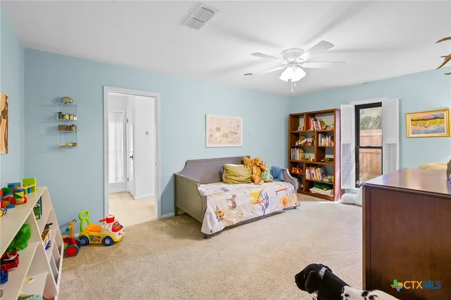 a bedroom with furniture and a window