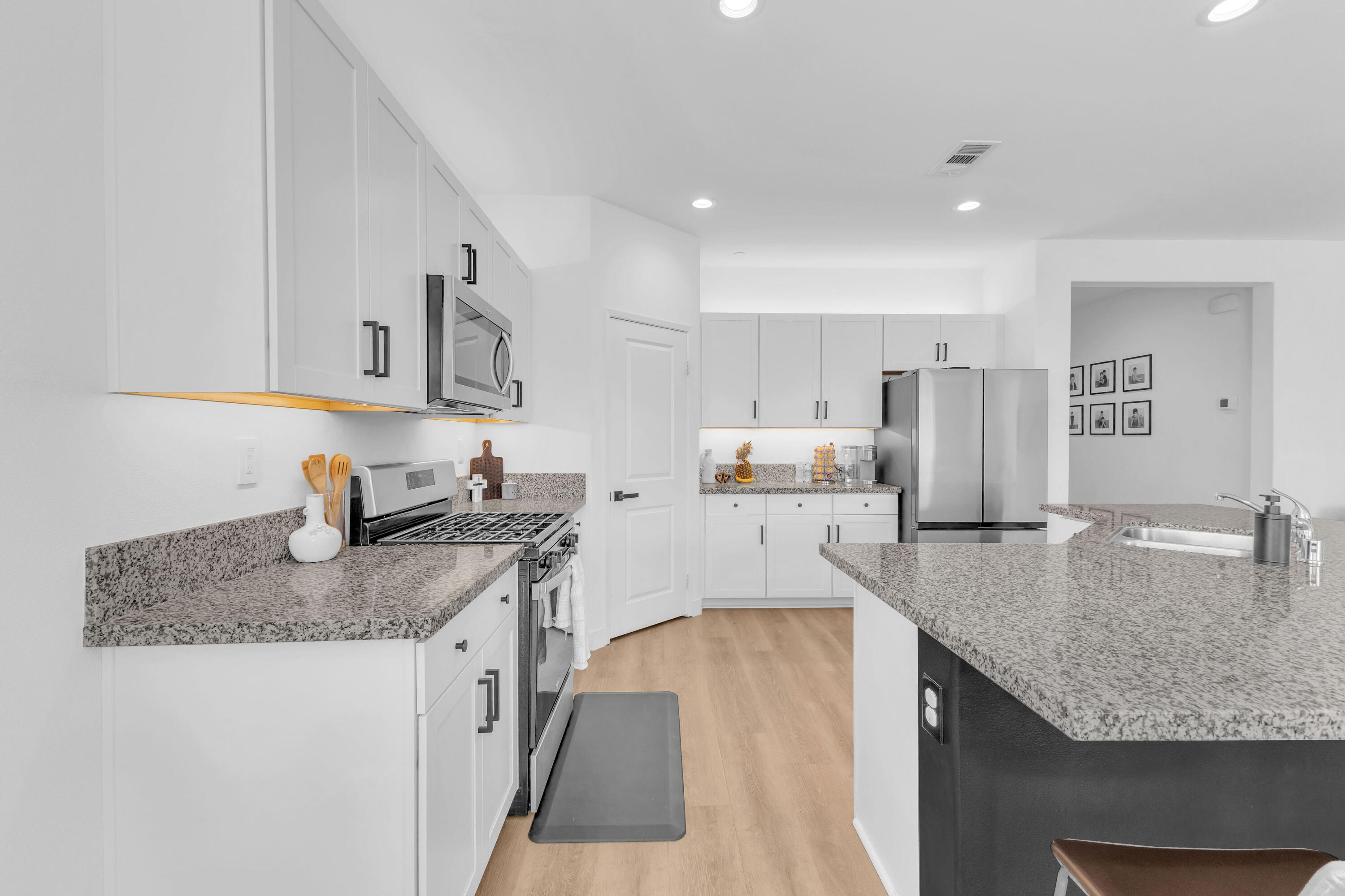 53020 Torino Place Coachella, CA 92236 - Photo 13 of 43 a kitchen with stainless steel appliances granite countertop a sink stove and refrigerator
