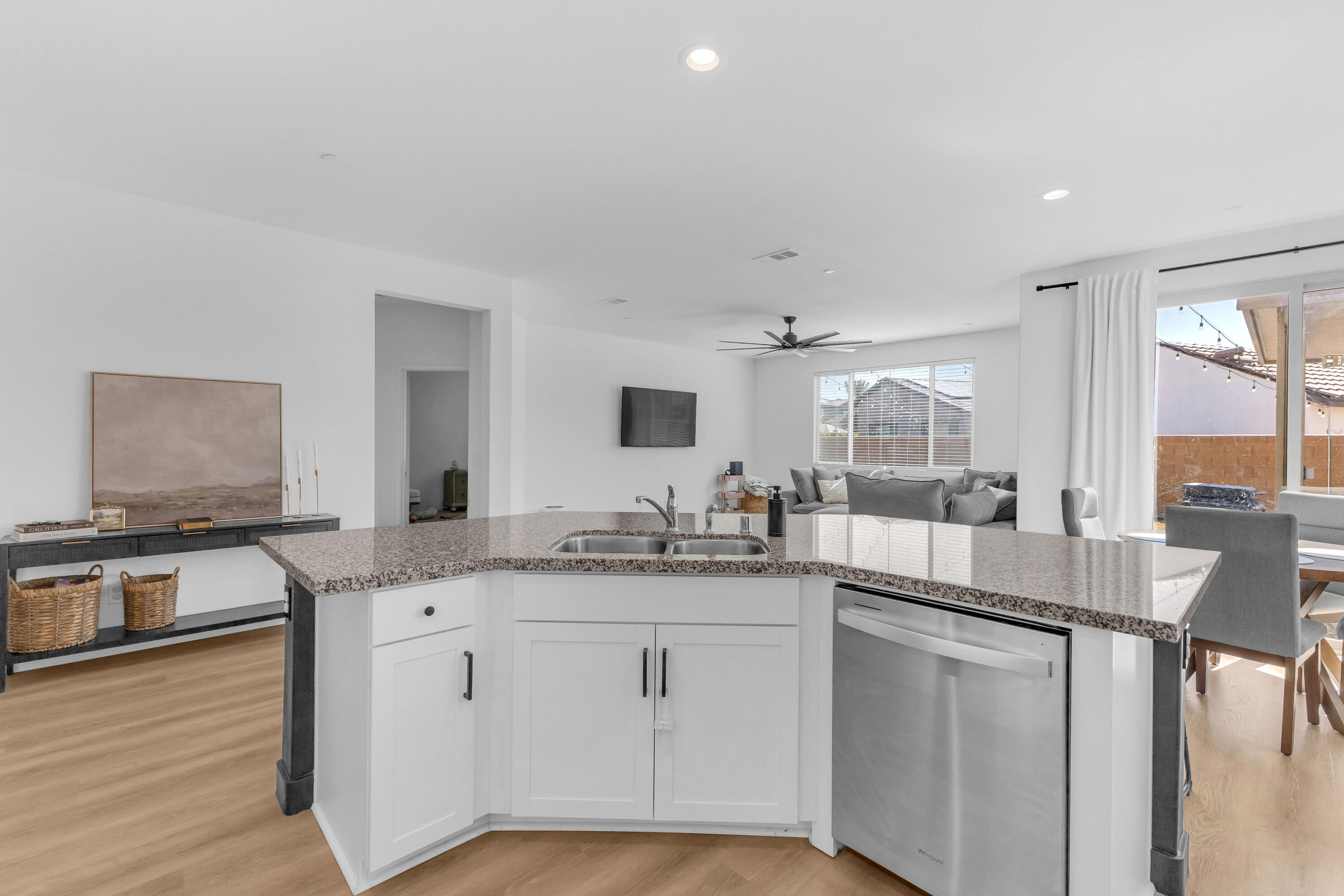 53020 Torino Place Coachella, CA 92236 - Photo 15 of 43 a open kitchen with stainless steel appliances granite countertop a sink and cabinets with wooden floor