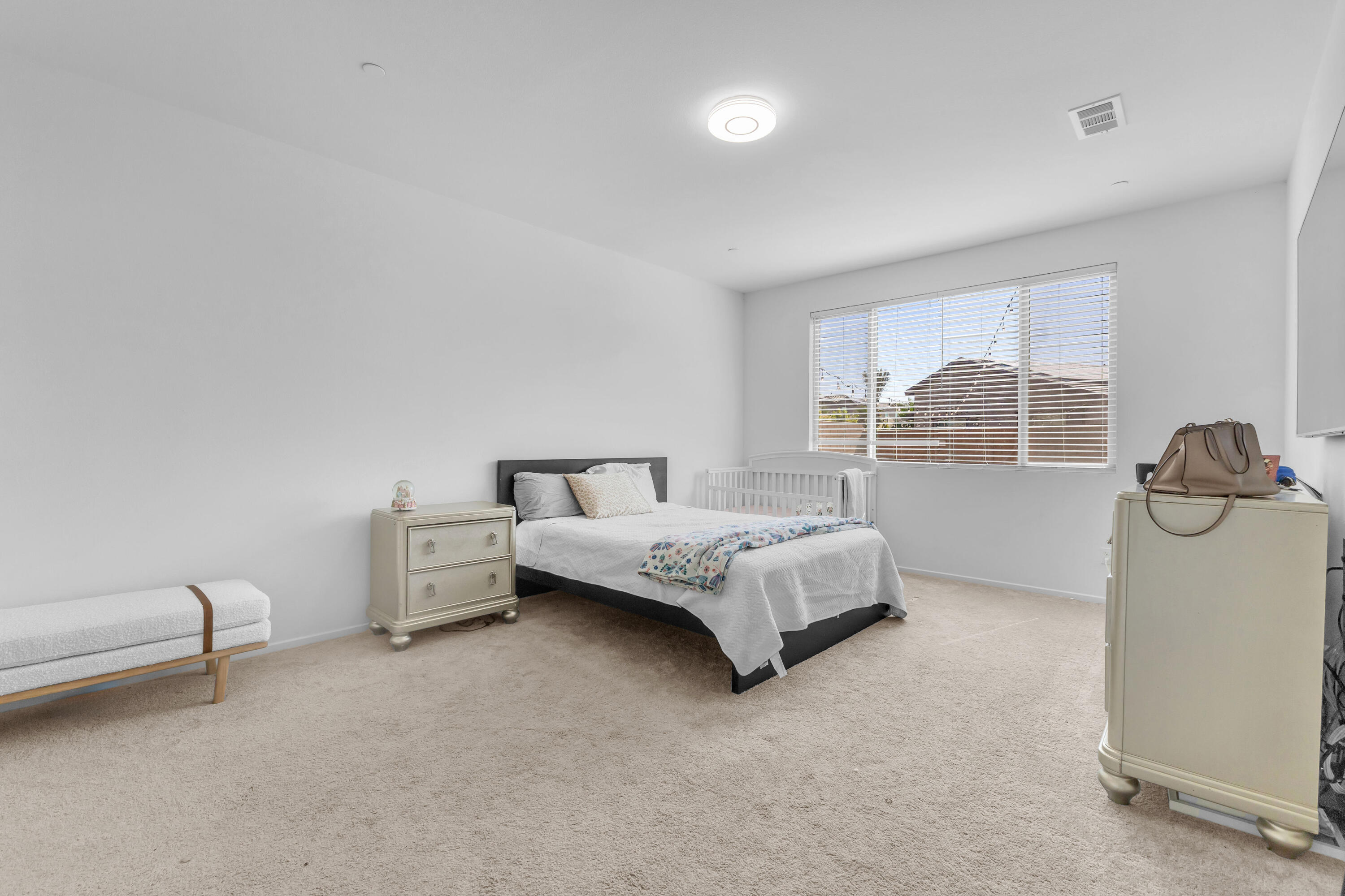 53020 Torino Place Coachella, CA 92236 - Photo 29 of 43 a bedroom with a bed and window