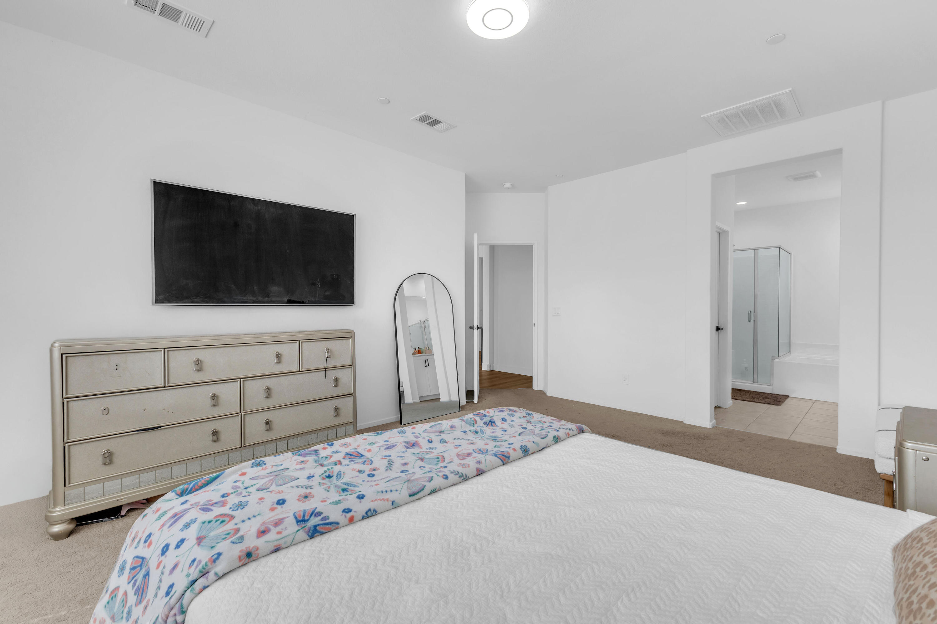 53020 Torino Place Coachella, CA 92236 - Photo 36 of 43 a bedroom with a bed and a flat screen tv in white walls