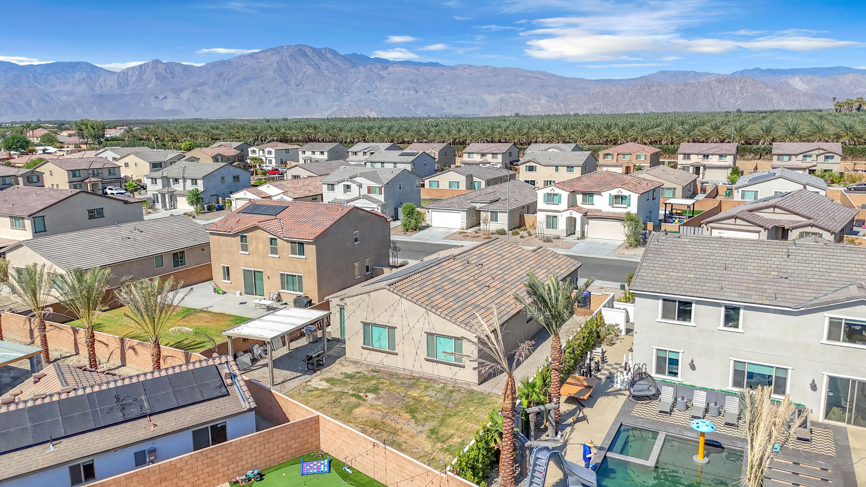 53020 Torino Place Coachella, CA 92236 - Photo 4 of 43 an aerial view of residential houses with outdoor space and mountain view