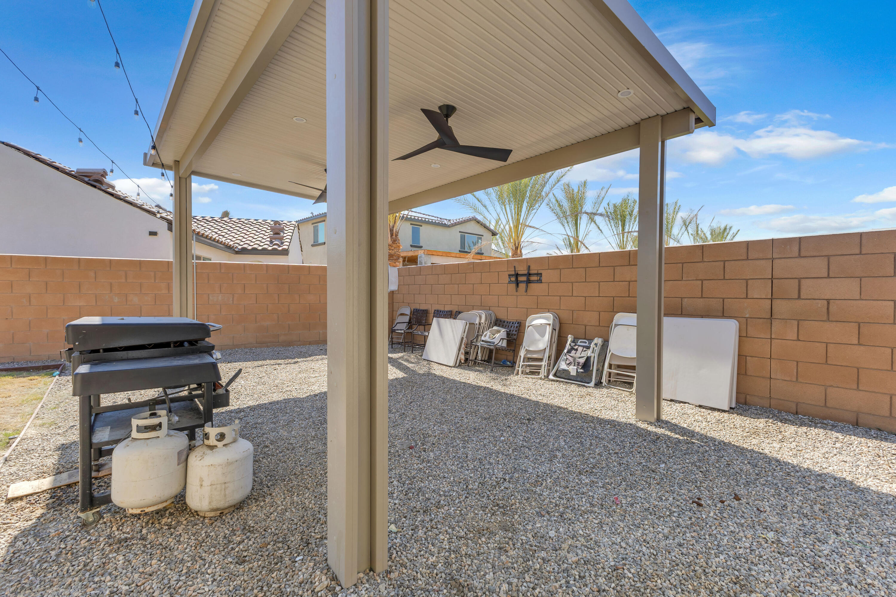 53020 Torino Place Coachella, CA 92236 - Photo 42 of 43 a view of a patio with table and chairs and potted plants