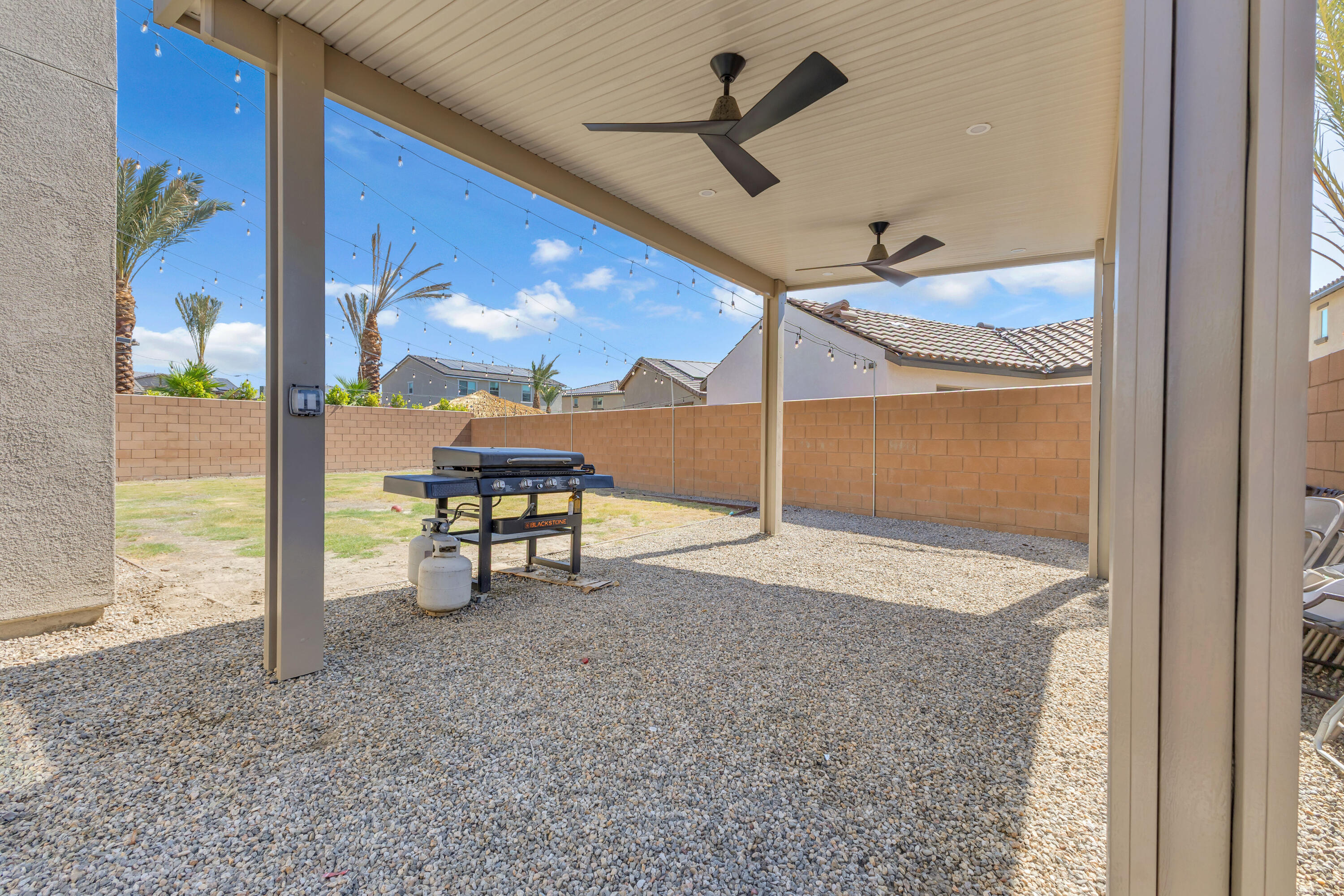 53020 Torino Place Coachella, CA 92236 - Photo 43 of 43 a view of a hallway with a dining table and chairs