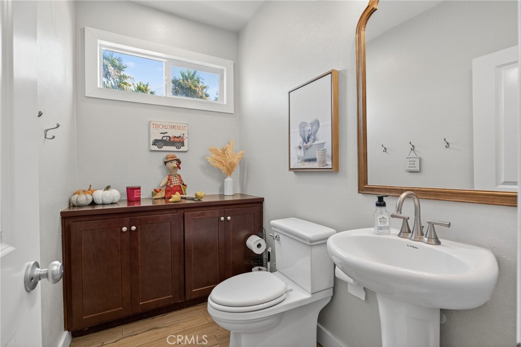 3459 North Oxnard Boulevard Oxnard, CA 93036 - Photo 18 of 54 a bathroom with a toilet a sink and mirror
