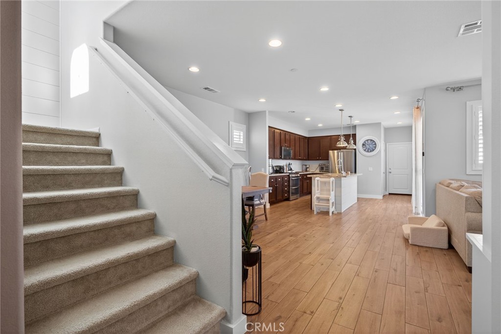 3459 North Oxnard Boulevard Oxnard, CA 93036 - Photo 20 of 54 a living room with furniture and a wooden floor