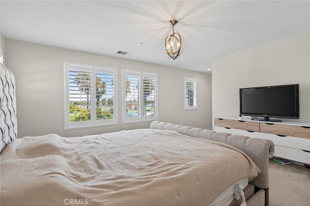 3459 North Oxnard Boulevard Oxnard, CA 93036 - Photo 24 of 54 a bedroom with a bed and a flat screen tv