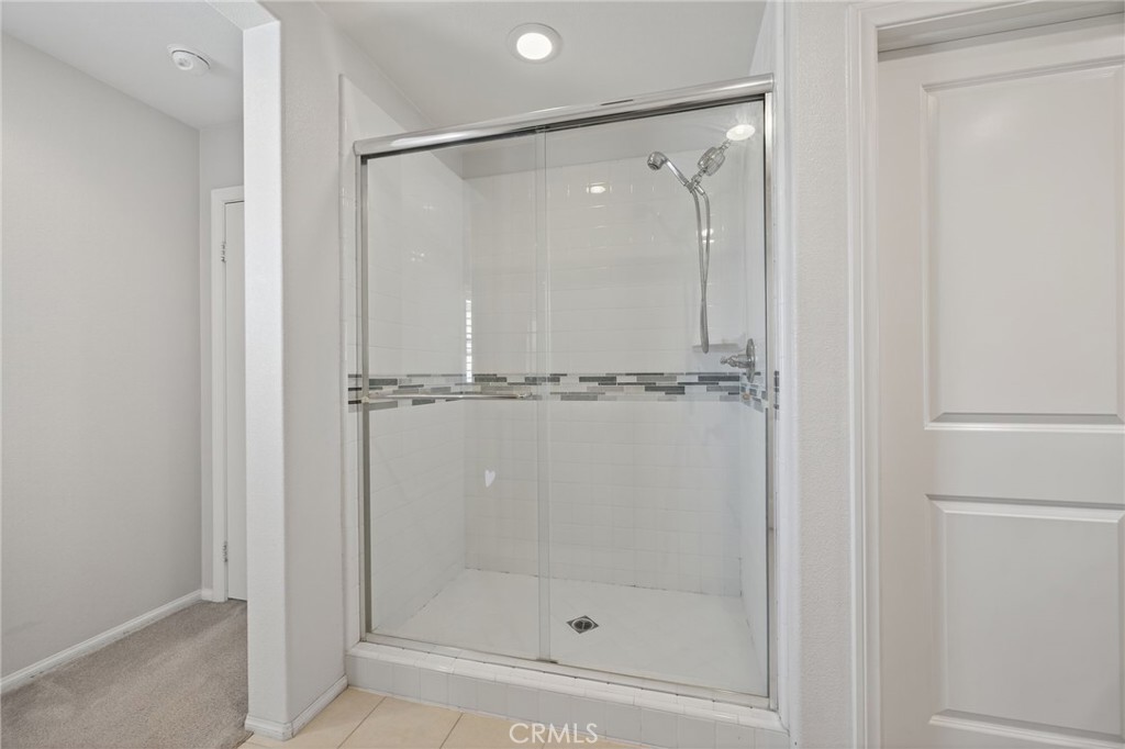 3459 North Oxnard Boulevard Oxnard, CA 93036 - Photo 27 of 54 a bathroom with a glass shower door