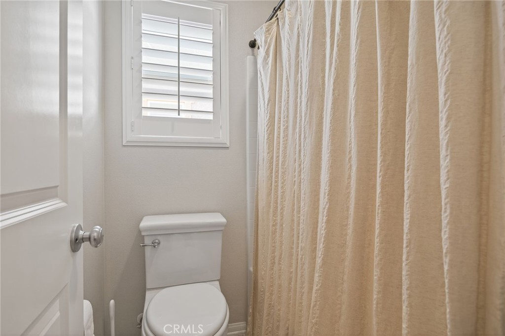3459 North Oxnard Boulevard Oxnard, CA 93036 - Photo 31 of 54 a white toilet sitting next to a window in a bathroom
