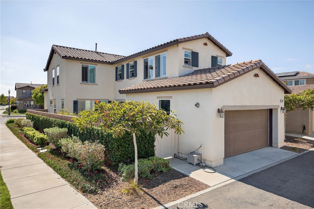 3459 North Oxnard Boulevard Oxnard, CA 93036 - Photo 41 of 54 a front view of a house with a garden
