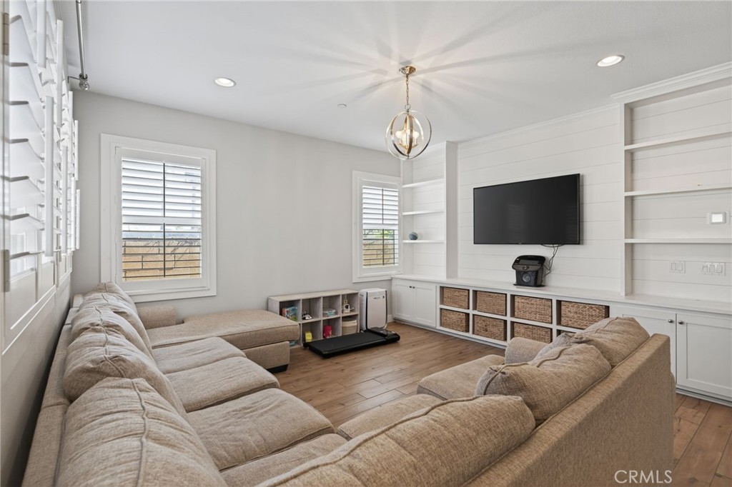 3459 North Oxnard Boulevard Oxnard, CA 93036 - Photo 7 of 54 a living room with furniture and a flat screen tv