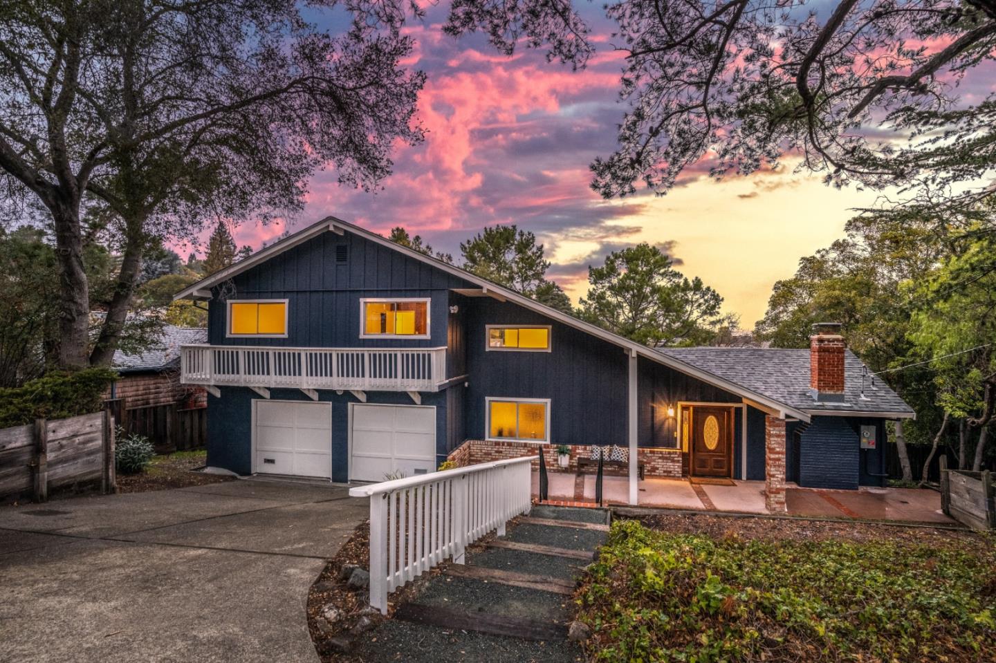 865 Sunset Drive San Carlos, CA 94070 - Photo 1 of 26 a front view of a house with a yard