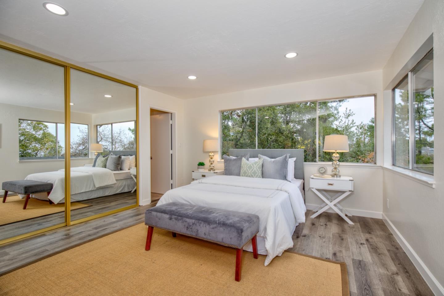 865 Sunset Drive San Carlos, CA 94070 - Photo 12 of 26 a bedroom with a bed and large window with balcony view