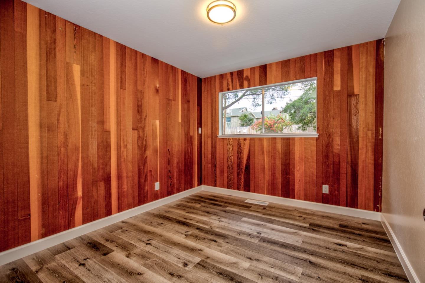 865 Sunset Drive San Carlos, CA 94070 - Photo 19 of 26 a view of a room with a bed and a curtain